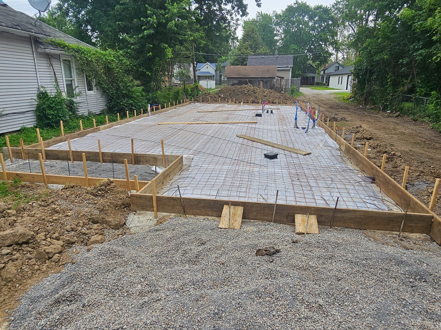 Slab reinforcement and utility rough-ins